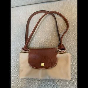 Authentic tan small longchamp Le Pliage bag.